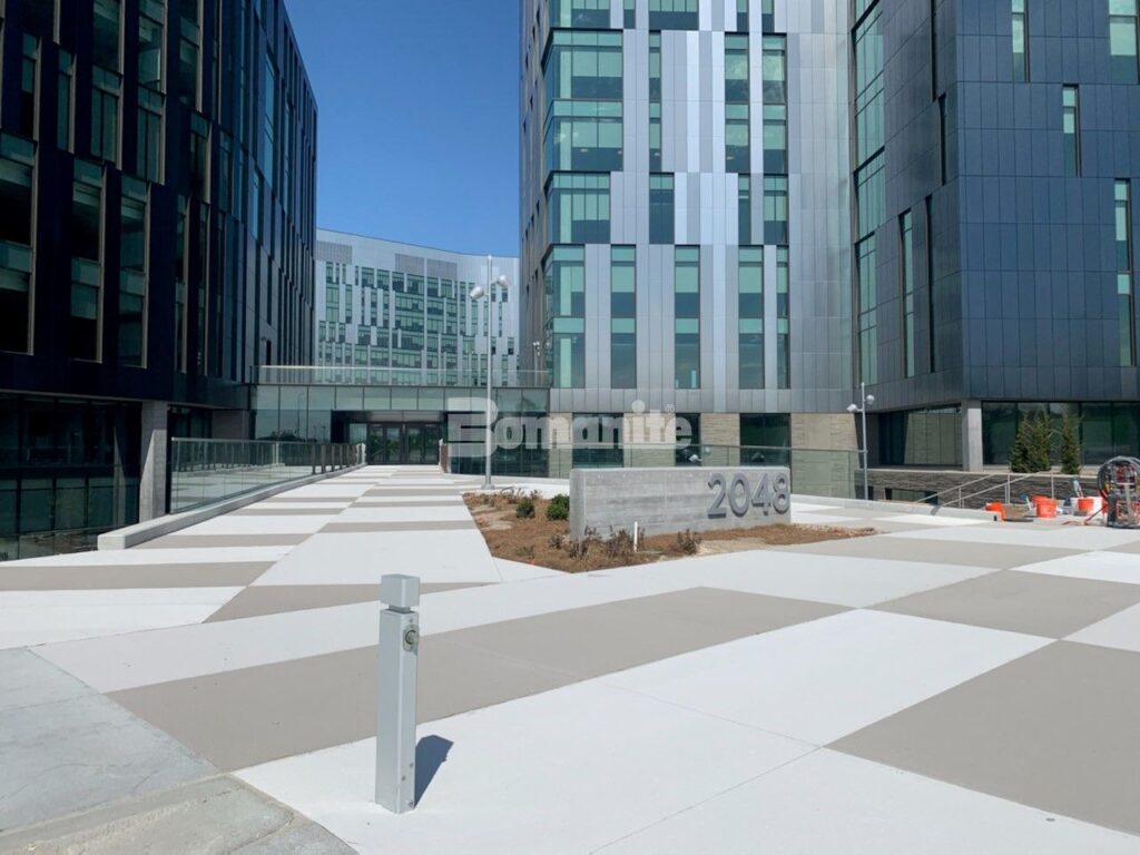 A wide-angle view of the Cerner Entrance, highlighting the seamless application of Bomanite Micro-Top XT and ST by Musselman & Hall, providing a durable and stylish concrete surface for high-traffic areas.