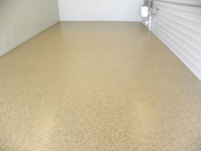 Broadcast Flake Installed in a floor by Bomanite